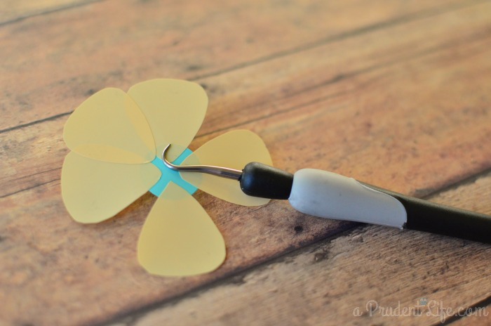 Attach vinyl petals to center circle to form flower