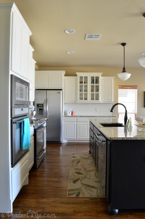 White Kitchen Black Island Wood Floor