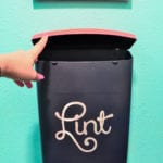 This is a great idea if you don't have room for a trash can in the laundry room - make a wall mounted lint bin next to the dryer!