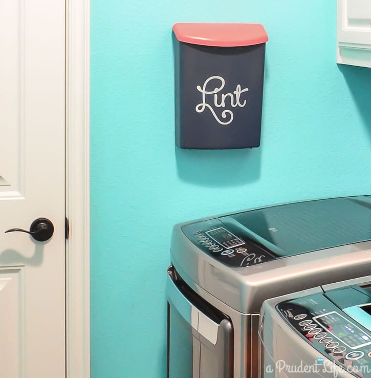 Wall mounted bin for lint in laundry room