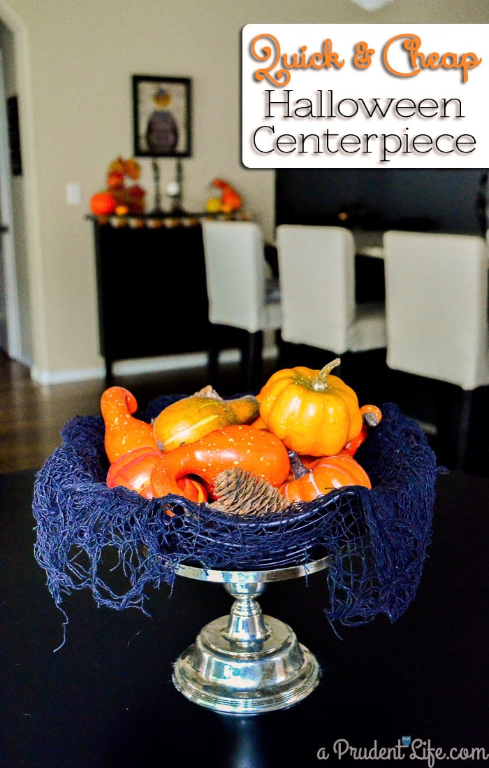 Turn a thrift store candle stick & dollar store materials into a cute Halloween centerpiece in under a minute!