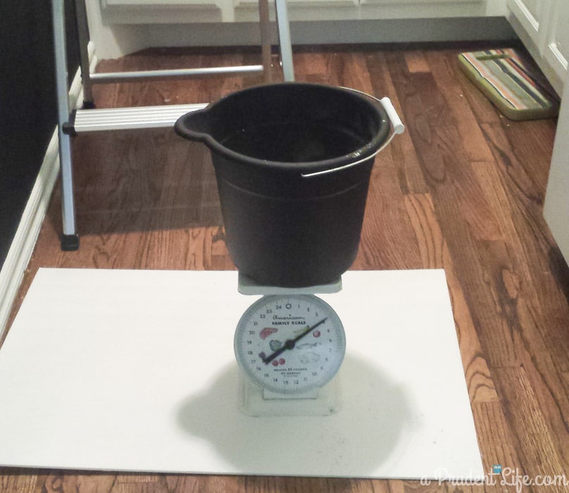 Kitchen scale used to weigh grout mixture