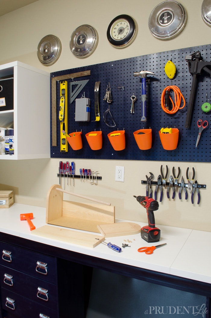 Our DIY work bench was put together with IKEA supplies to keep the price low. Using RAST dressers, LINNMON table tops, and KALLAX shelves let us customize the perfect space on a budget.