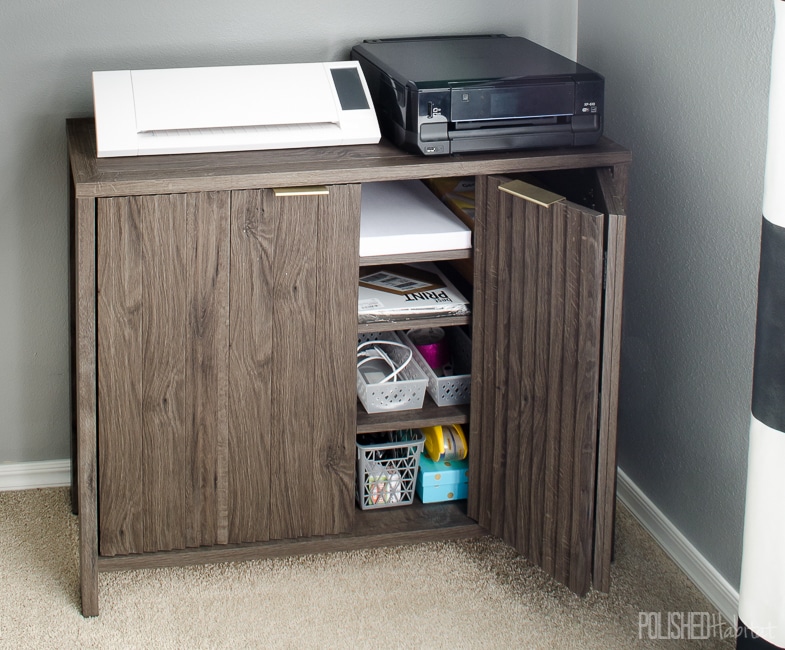 Using closed storage under the printer allows quick, but hidden, access to printer paper and extra ink cartridges. Click to see the full shared home office tour! 