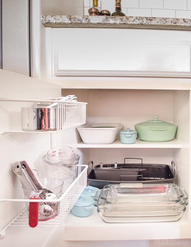 Don't overlook cabinet doors when organizing a kitchen. Inexpensive wire shelves are great for measuring cups and spoons! See more kitchen organizing at PolishedHabitat.com