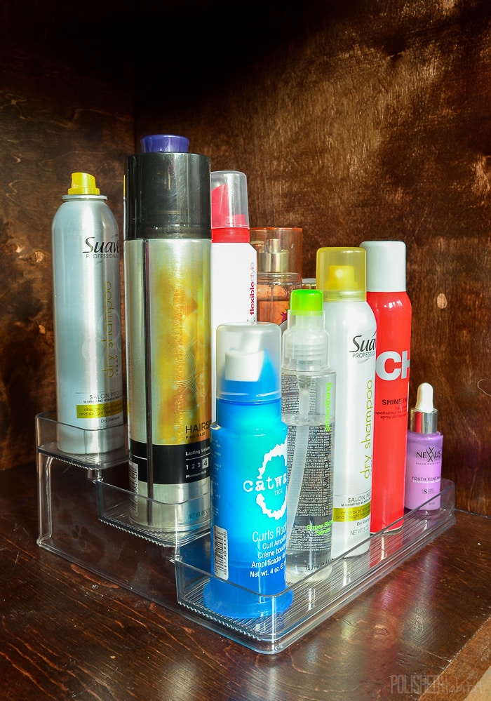 No more bathroom clutter! Move hair products under the sink to keep the bathroom vanity organized. 