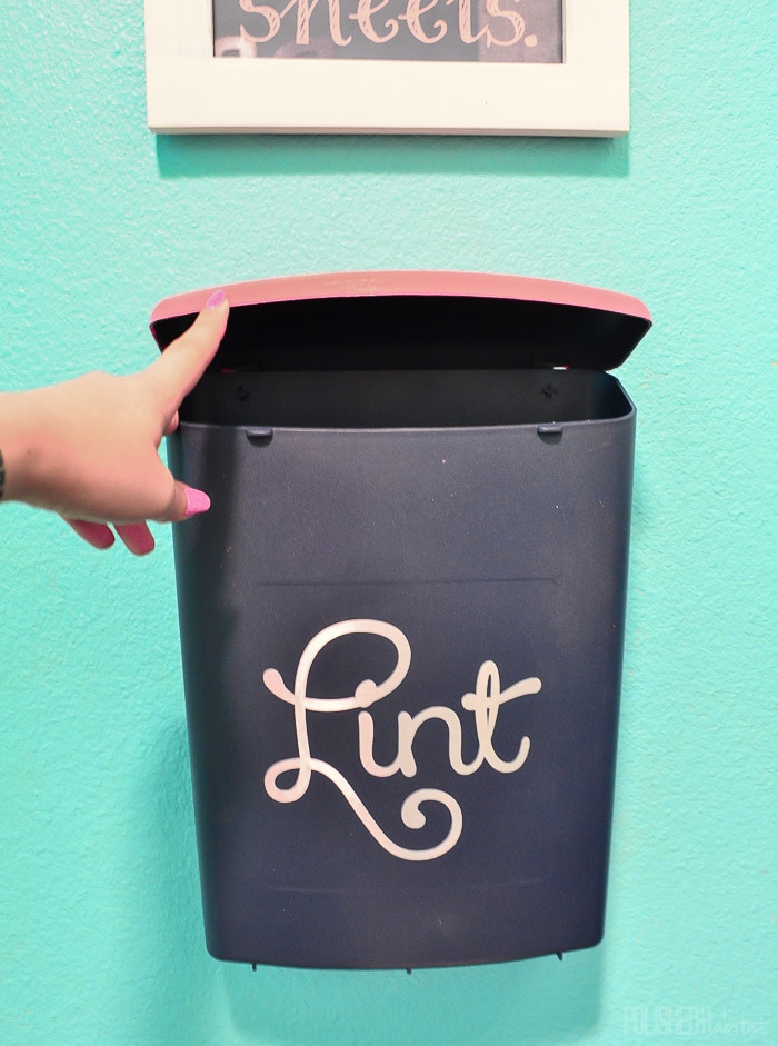 This Lint Bin is wall-mounted to save floor space. It's great for keeping the laundry room neat! 