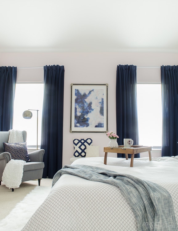 Gorgeous master bedroom with dramatic navy drapes. It's so glam and cozy at the same time. 