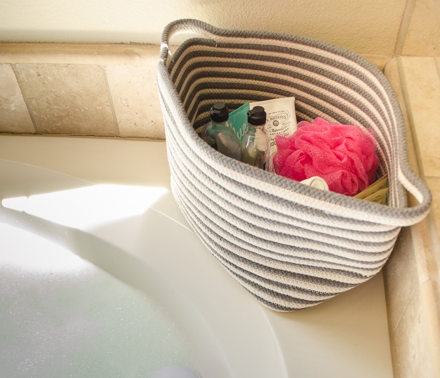 Use a basket to keep bubble bath, razors, and shaving cream out of sight but easy to access!