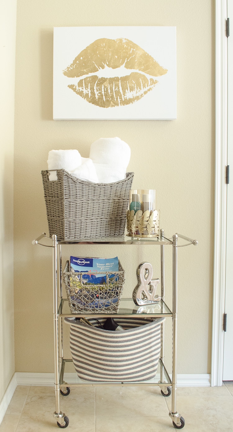 Bathroom Storage Solutions - Add a small tiered cart and baskets to hide bathroom clutter. Click for more bathroom organization tips!