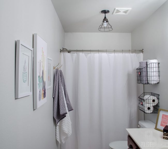 Budget Bathroom Makeover - This guest bathroom went from boring beige to organized modern industrial style in one weekend for under $300.