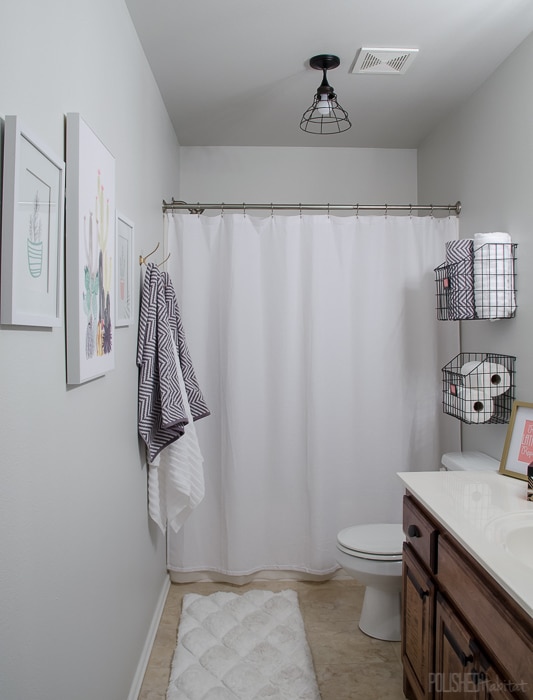 Budget Bathroom Refresh - This guest bathroom went from boring beige to organized modern industrial style in one weekend for under $300.