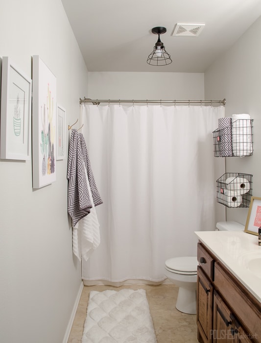 Budget Bathroom Refresh - This guest bathroom went from boring beige to organized modern industrial style in one weekend for under $300. 