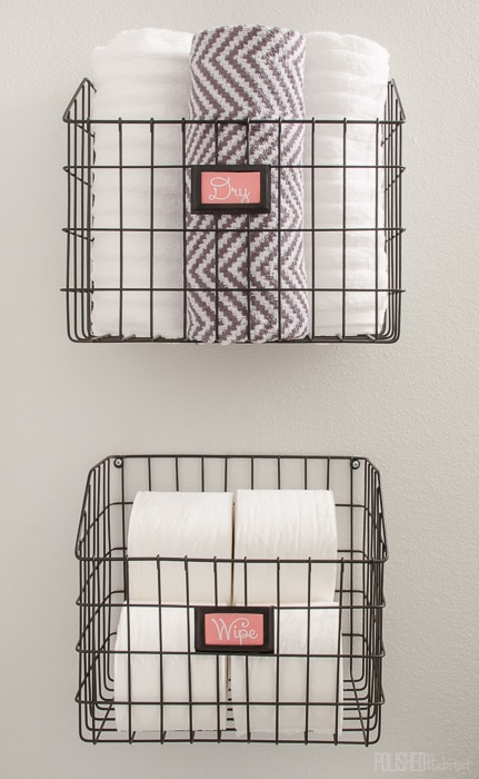 Mount baskets on the wall to add bathroom storage without paying for a pricey cabinet. 