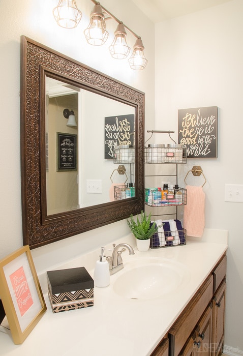 Use a tiered organizer to add lots of bathroom storage on a budget. 
