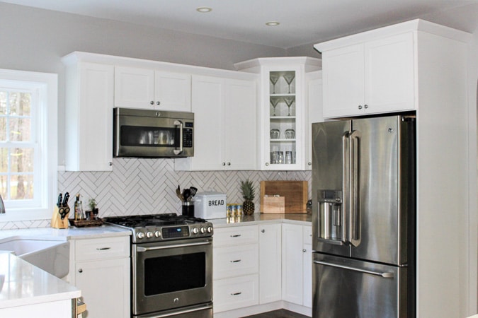 White modern farmhouse kitchen - can you believe this used to be a dark, oak kitchen? 