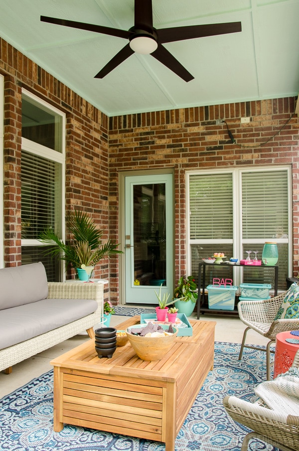 Patio Makeover! This porch went from dreary to a perfect relaxing spot for reading or entertaining. The furniture was provided by Cost Plus World Market. Click for before and more after photos! #ad