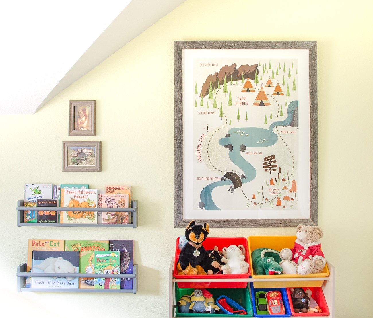 Books displayed front forward on wall racks in camping themed boy's room