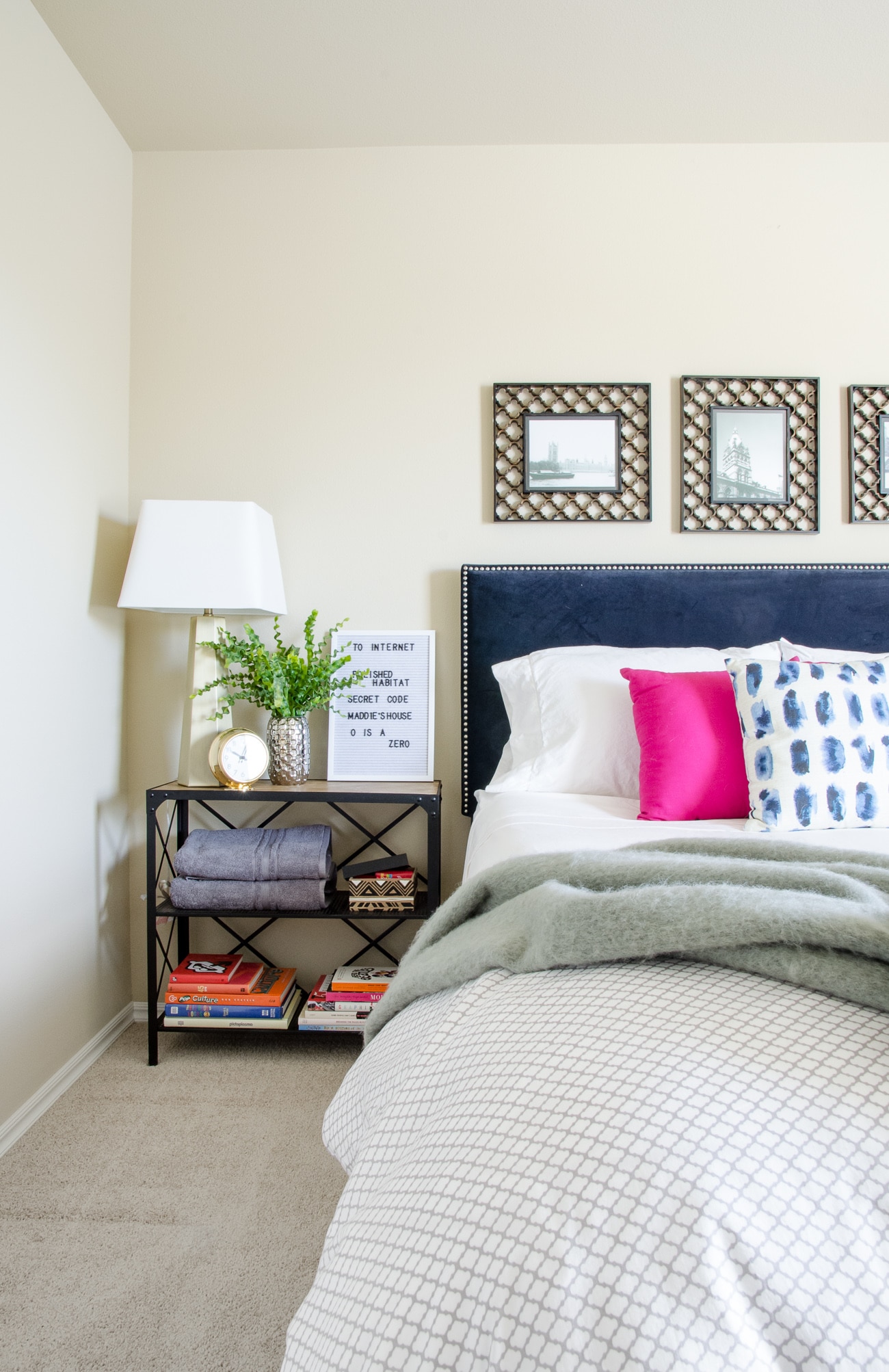 Guest bedroom with bookshelf that doubles as a nighstand