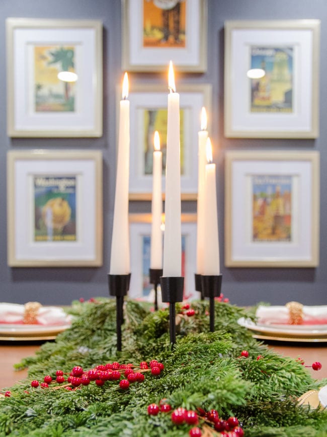 Threshold modern black candlestick with fresh greenery as a table runner for Christmas