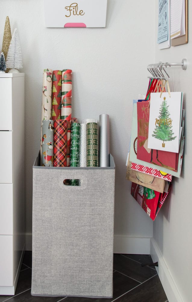 Keep wrapping paper organized with a hamper and one little trick to keep it straight. 