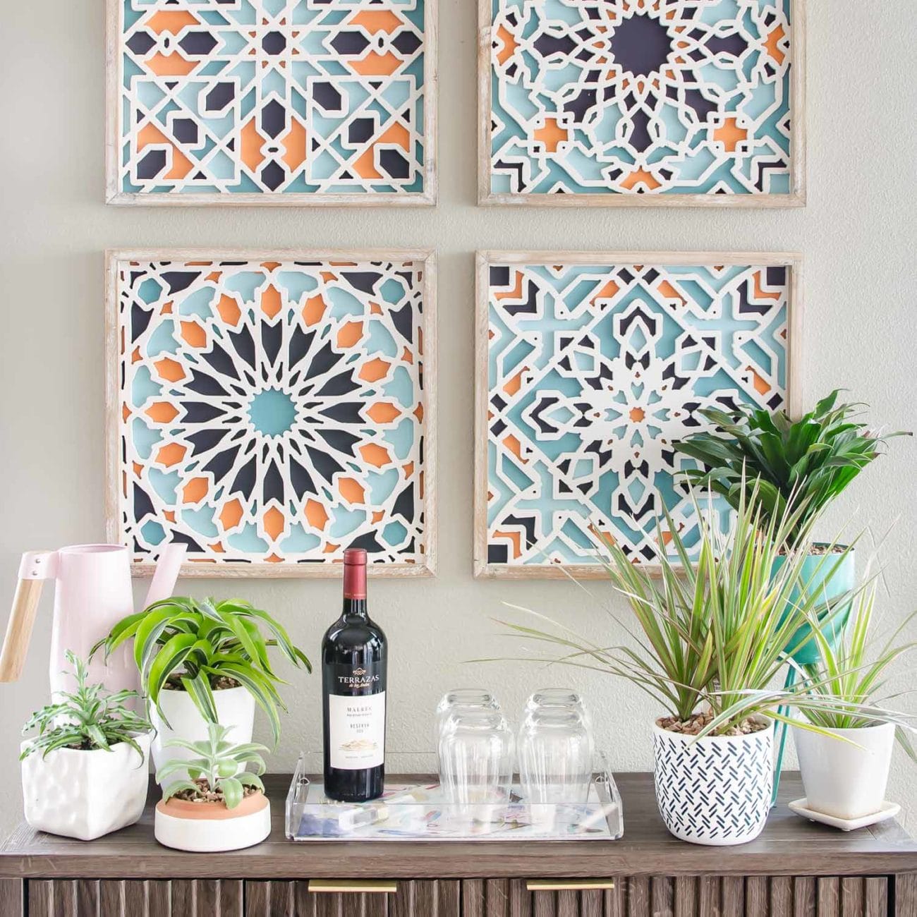 Colorful art and console styling in small kitchen nook.