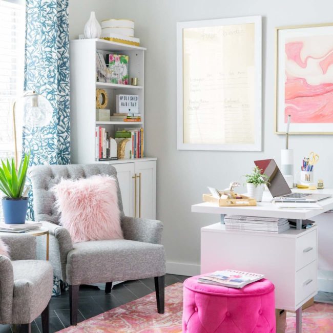 Pink, white, and gold women's office with extra seating and bookcases