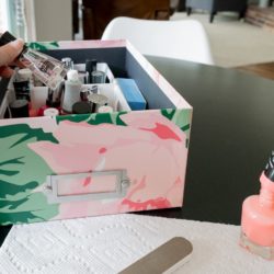 Pretty floral storage box containing nail polish / manicure supplies.