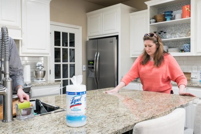 Keeping the kitchen counters clean using Lysol Daily Cleaning Wipes