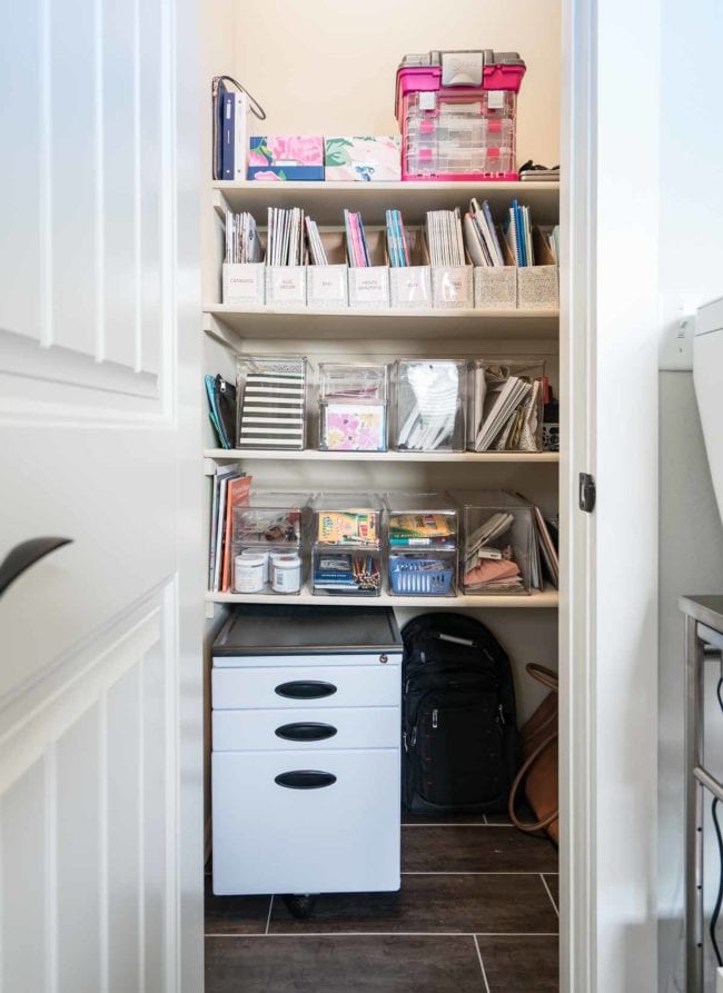 Organized office shelves with file cabinet. 