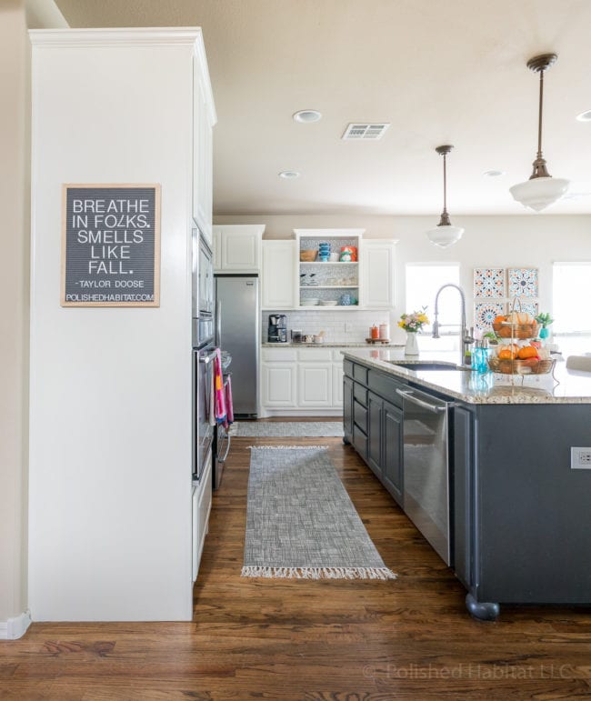 White Dove Kitchen Cabinets with black island 