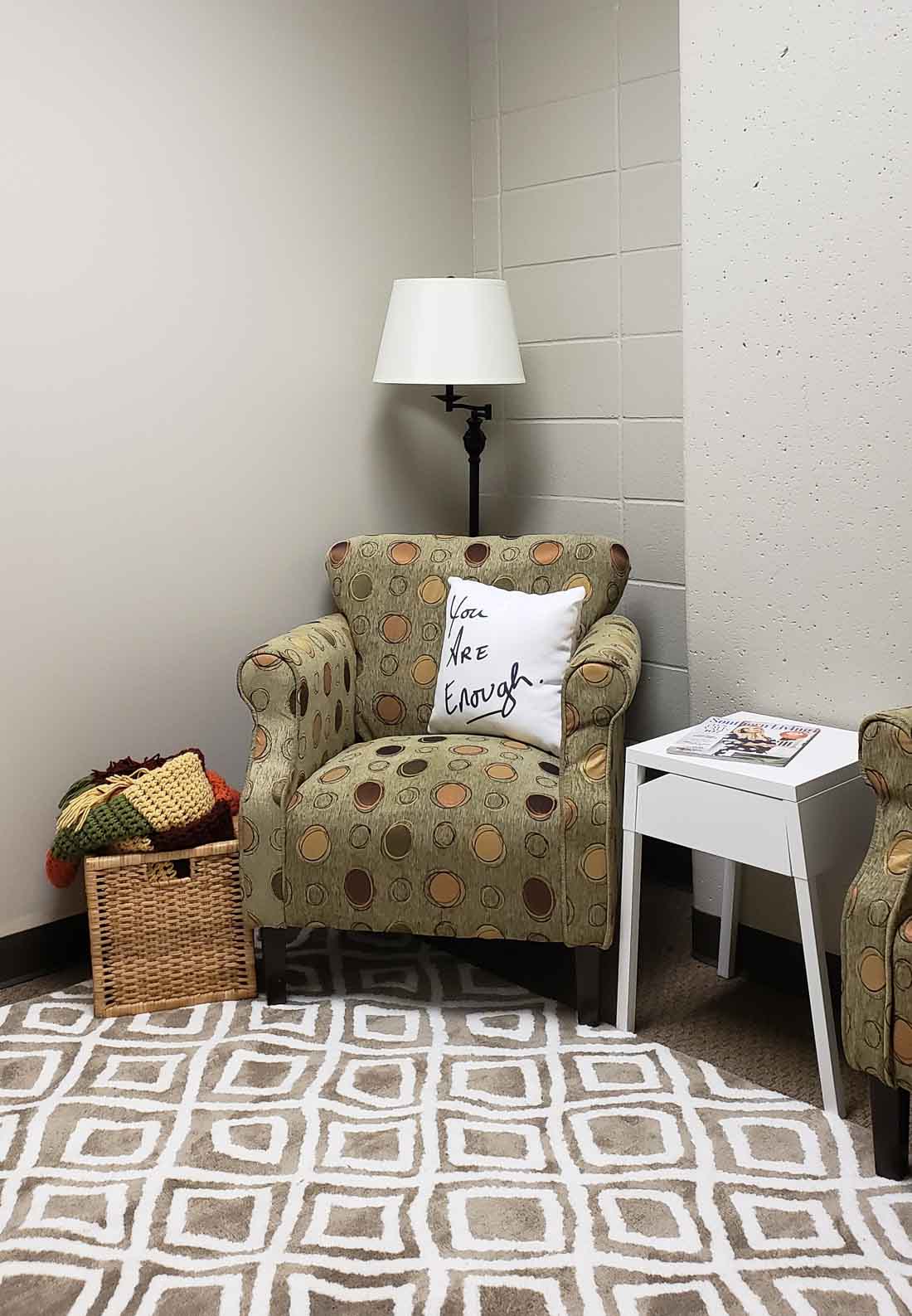 Comfy chairs with cheerful pillows.