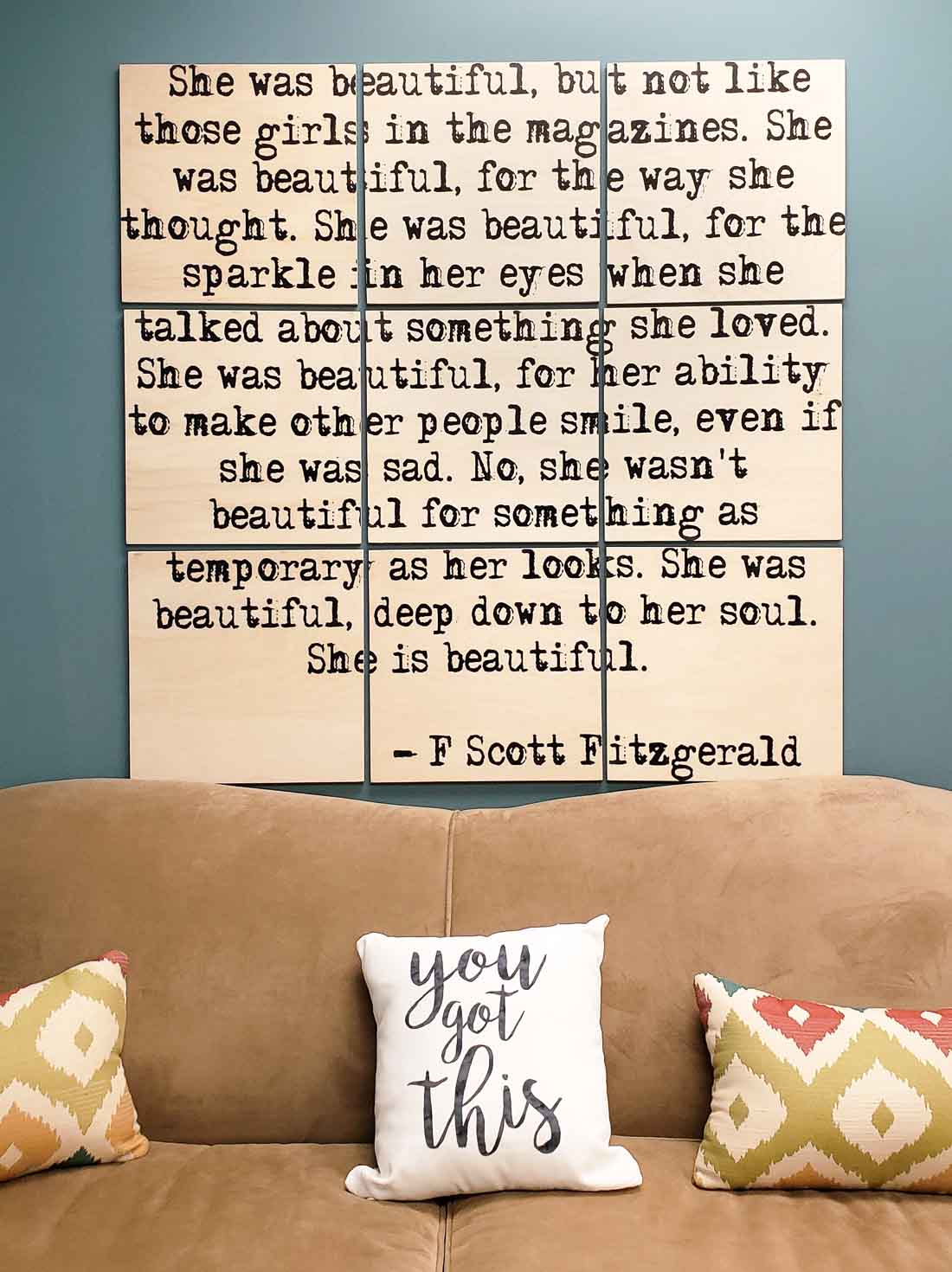 Society 6 quoted wall art above couch.