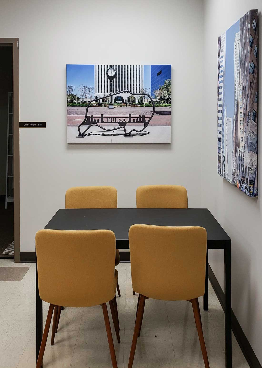 Yellow chairs at a rectangle dining table.