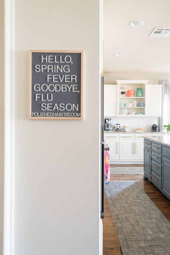 Letterboard in kitchen with Hello Spring Fever, Goodbye Flu Season quote