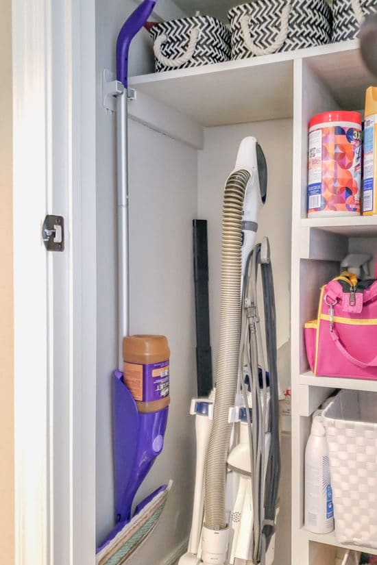 Organized Cleaning Closet with Swiffer Hung On Wall