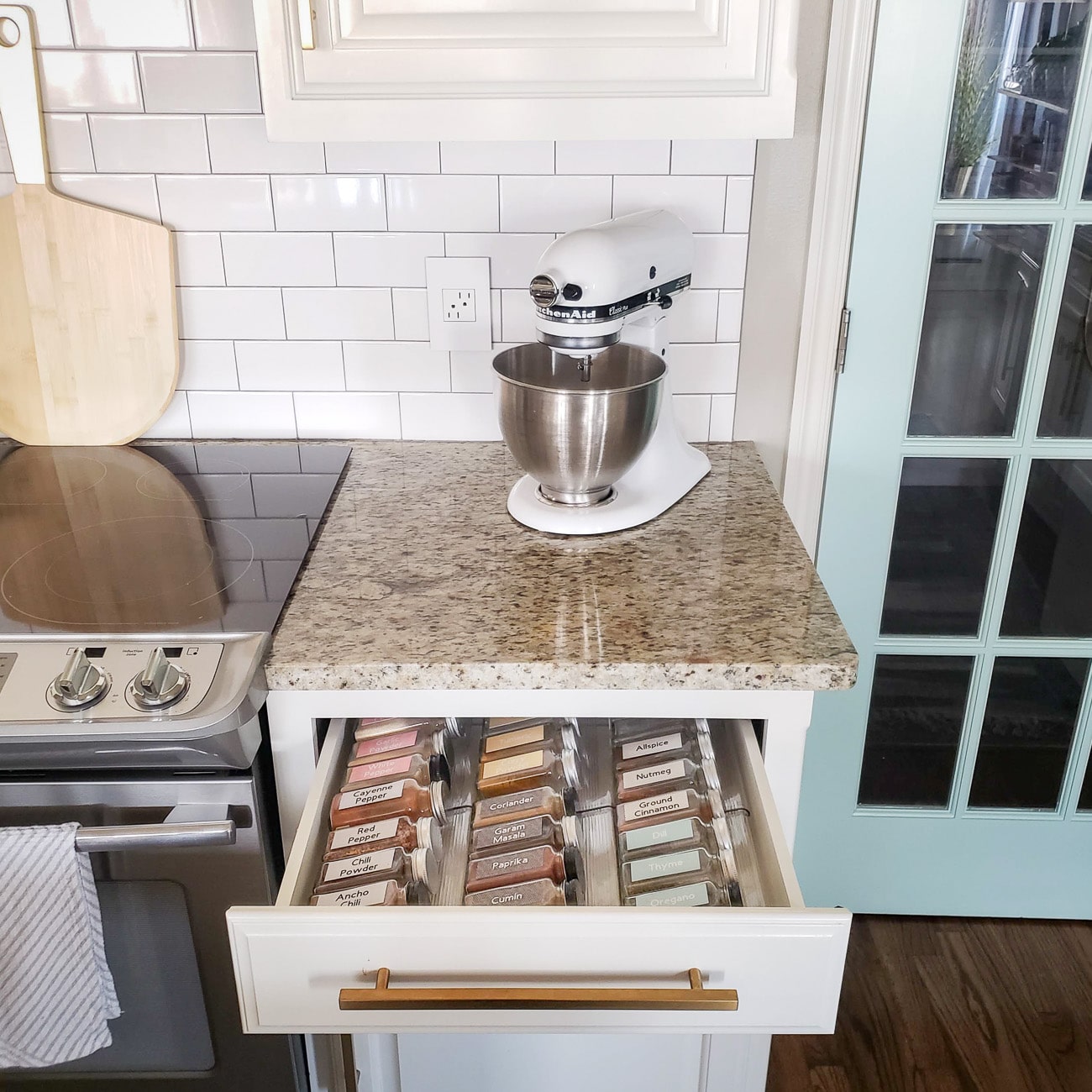 White Kitchen with Open Drawer showing How to Organize Spices