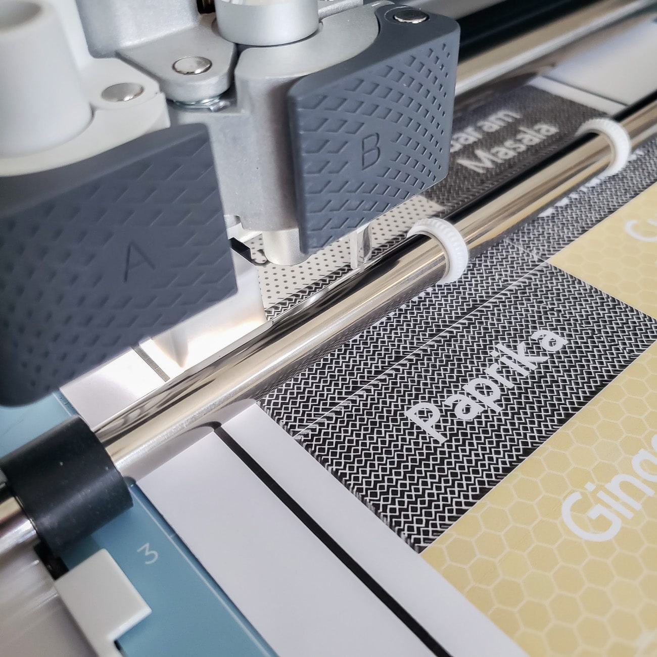 Close up of Cricut Maker Finding Guideline for Print Then Cut Labels