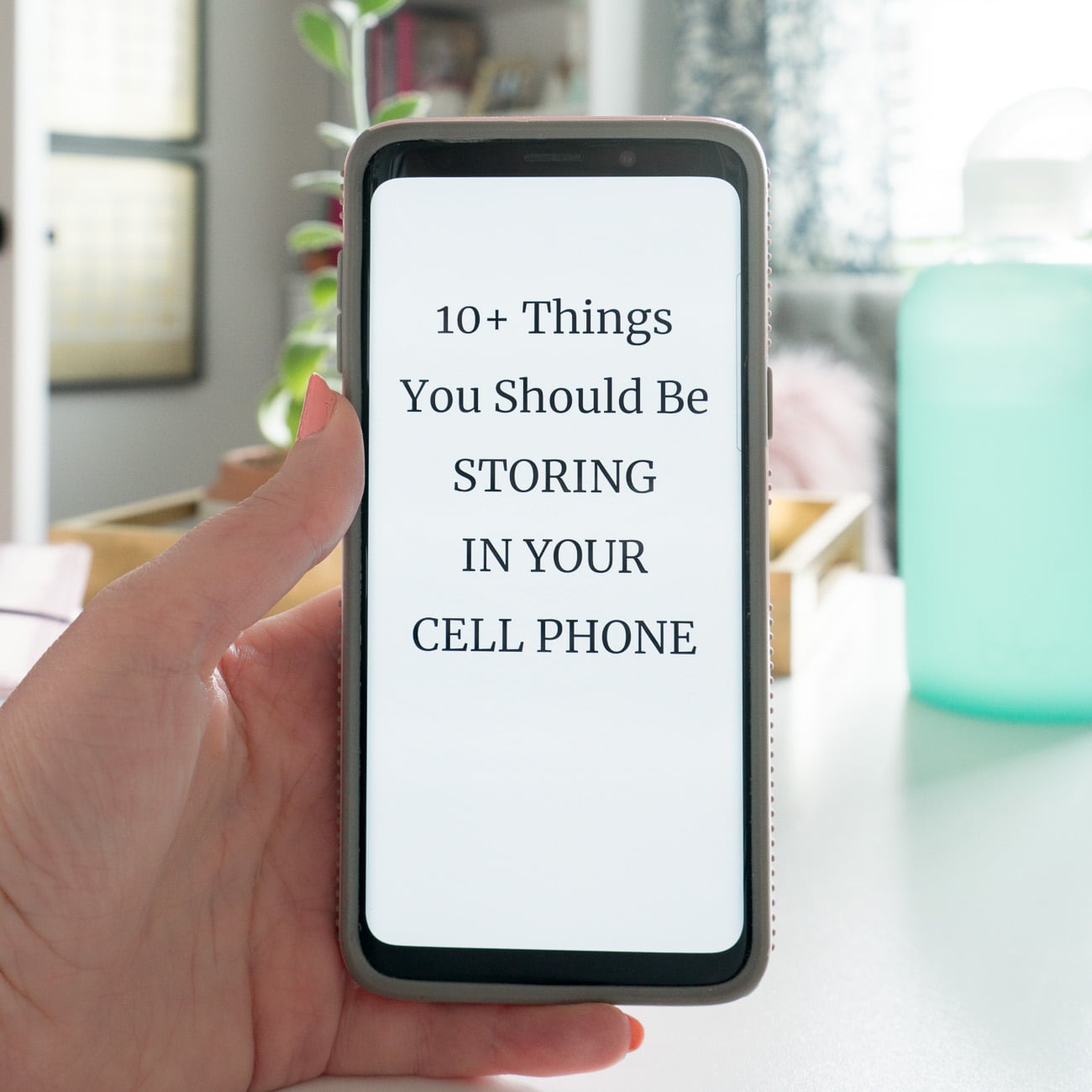 Phone with text on screen: 10 Things You Should be Storing in Your Cell Phone