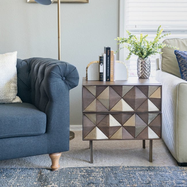 Gray chair with glam end table with drawers