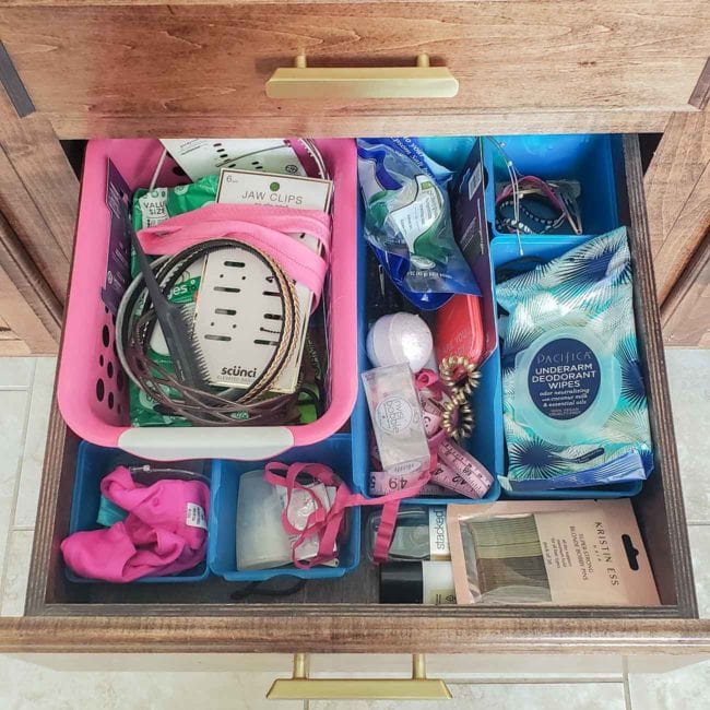 Inside a messy bathroom drawer