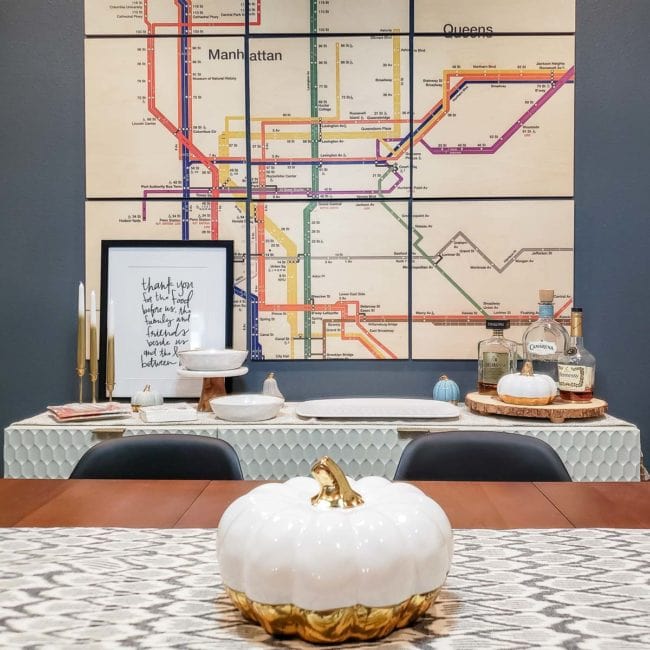 white pumkin with gold buttom on dining room table