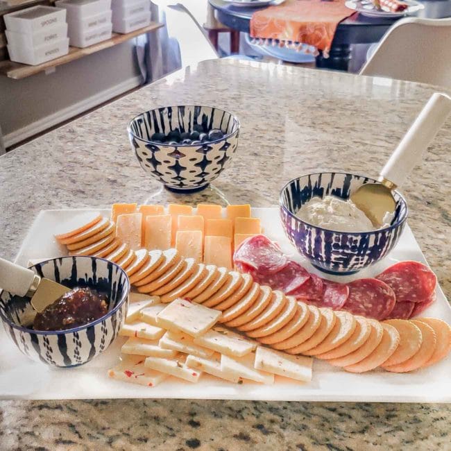 Simple cheese board on white plate