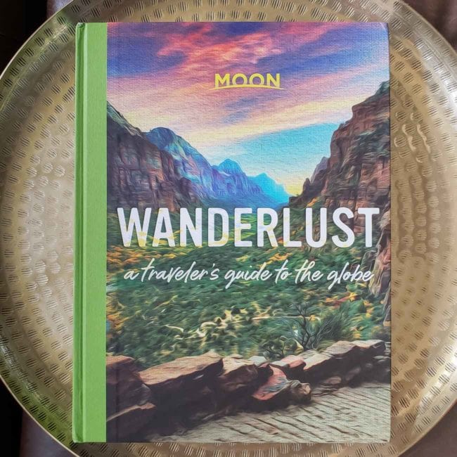 Wanderlust travel book with canyon & colorful sky on the cover