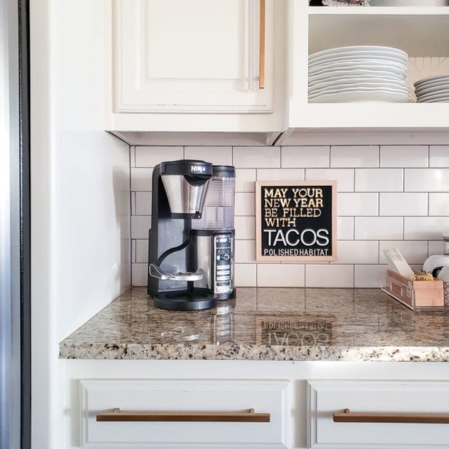 White kitchen with black letterboard - May Your New Year Be Filled With Tacos