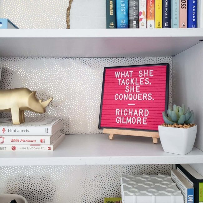 White girly office shelves with pink new years letter board