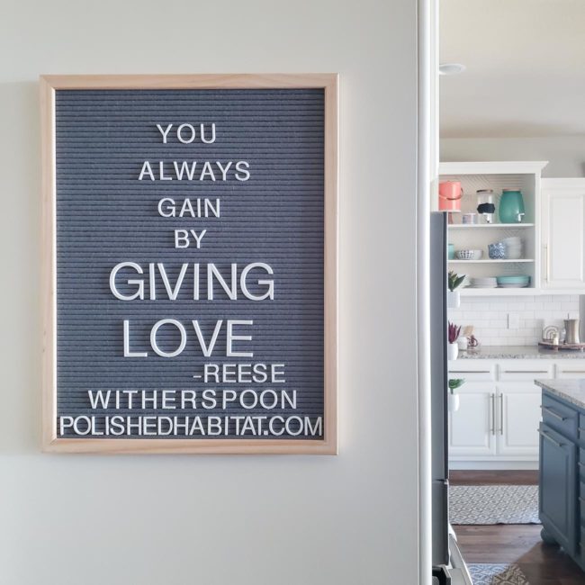 Grey Letter Board with White Letters - You Always Gain by Giving Love.