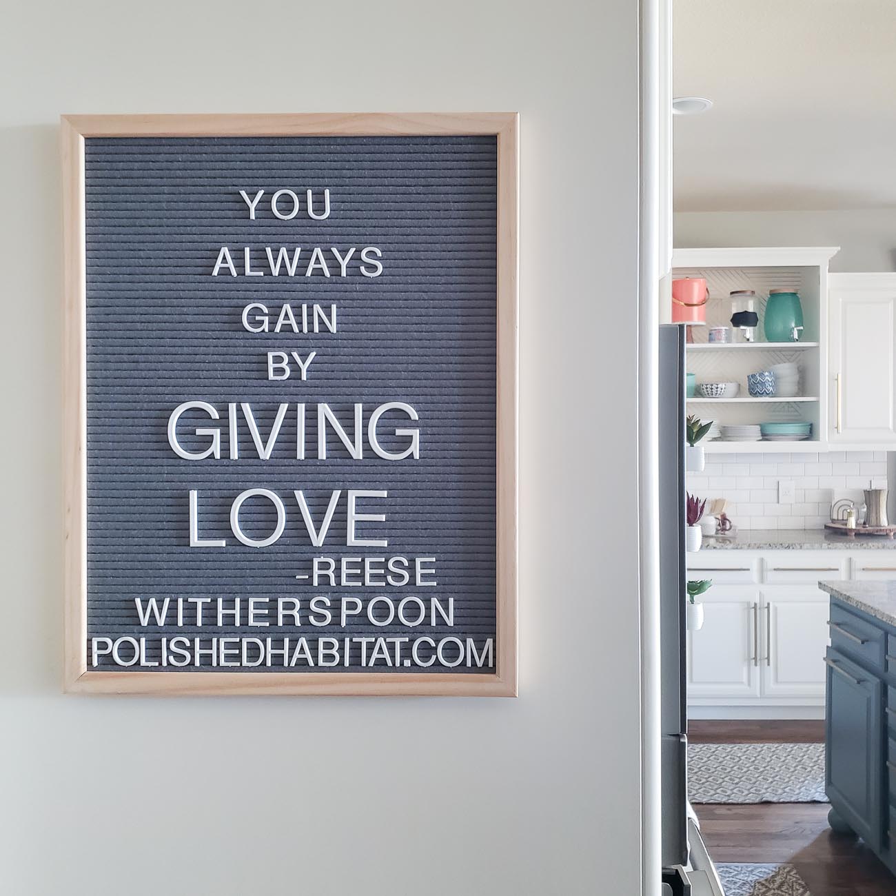 Grey Letter Board with White Letters - You Always Gain by Giving Love.