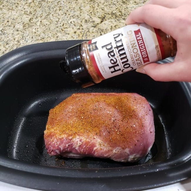 Seasoning a pork roast in a crock pot