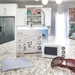 LUX CS1 Thermostat & Box on Kitchen Counter